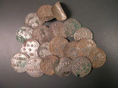 A photograph of a pile of silver Viking coins